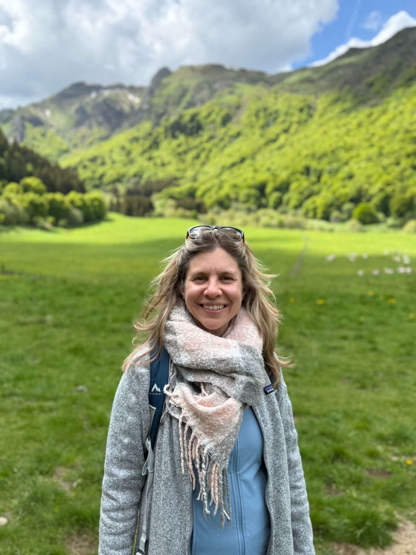 Mary in a green valley surrounded by hills